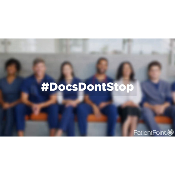 Background image blurred showing row of doctors sitting on a bench with hashtag DocsDontStop overlaid on it