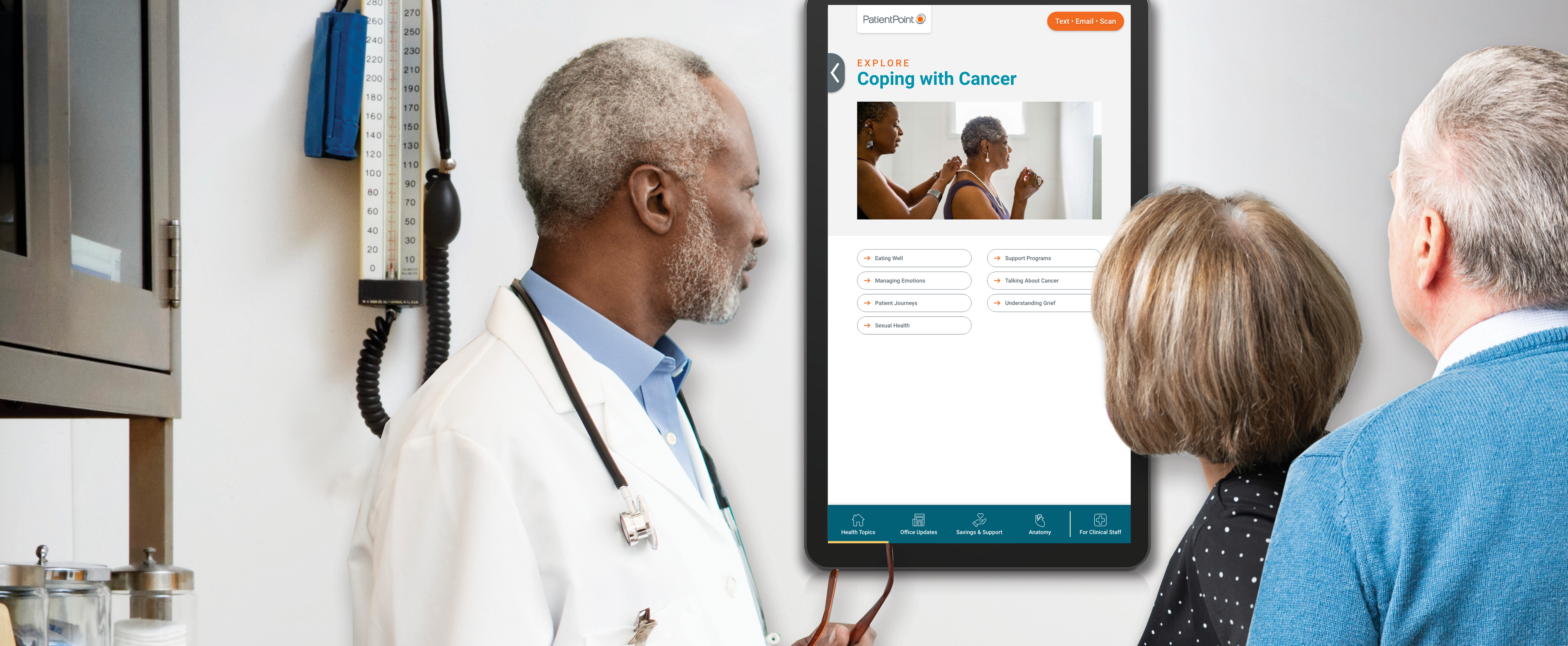 doctor and patients looking at exam room screen with cancer info