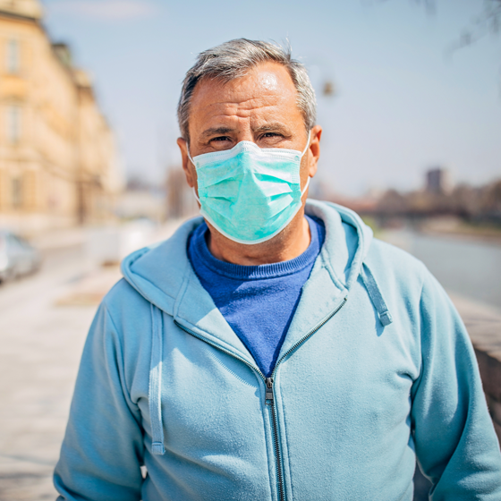Senior man outside wearing a face mask