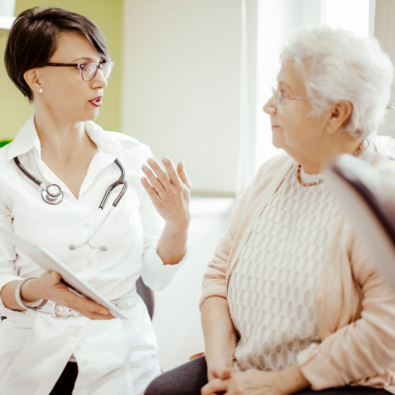 Senior patient discussing a treatment plan with her doctor.