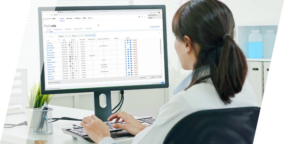 Doctor on desktop with Optimize Health patient dashboard