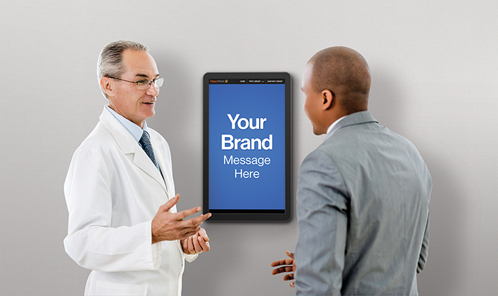 Mature doctor discussing a brand ad displayed on a PatientPoint interactive exam room touchscreen.